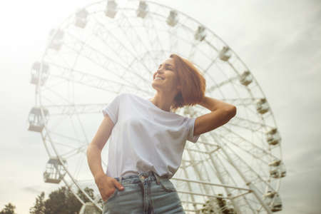 Beautiful tourist girl on city street. Gorgeous young model woman outdoor portrait. Fashionable wear.の写真素材