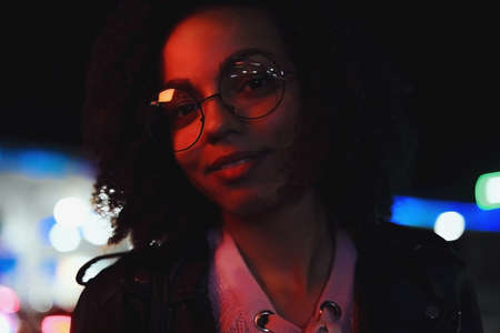 Black girl portrait in night city lights. Stylish African girl for lifestyle design