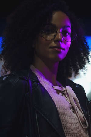 Night portrait of beautiful fashion young african american girl. Cute curly modelの写真素材