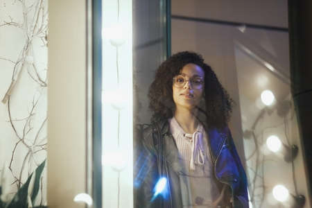Black girl portrait in night city lights. Stylish African girl for lifestyle designの写真素材