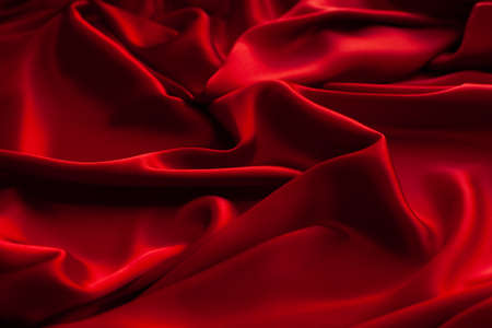 Red fabric texture background. Silk satin folds. Smooth elegant wallpaperの写真素材
