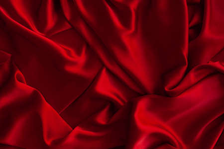Red fabric texture background. Silk satin folds. Smooth elegant wallpaperの写真素材
