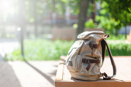 Vintage backpack on sunny city street. hipster travel bagの写真素材