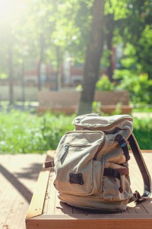 Vintage backpack on sunny city street. hipster travel bagの写真素材