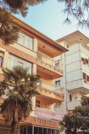 Old apartment building on sky background. Residential block flats house