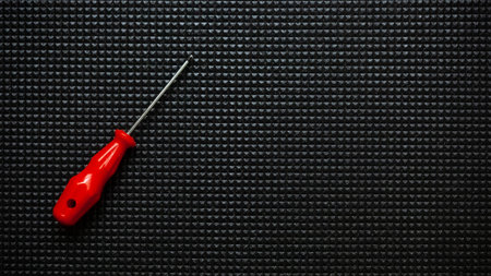 Red screwdrivers on black background. Work industrial conceptの写真素材