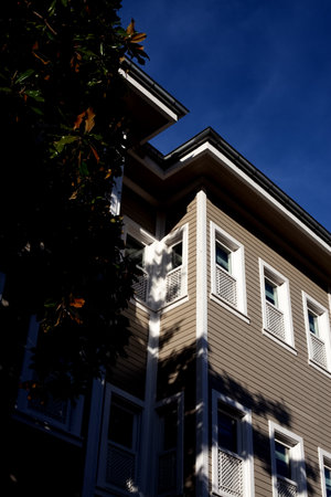 Exterior upper storey house with clear blue sky background. modern building