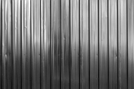 Gray metal fence texture background. Metallic corrugated silver patternの写真素材