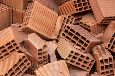 Red bricks heap. Background of bricks pile. Construction materialの写真素材