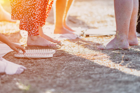 Feet on sharp nails sadhu board. Yoga meditation exerciseの写真素材