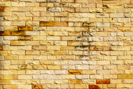 Yellow brick wall background. Old red brick texture. Vintage designの写真素材