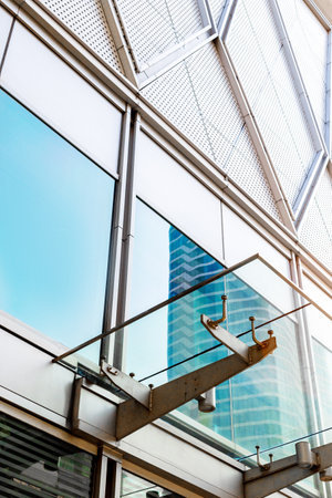 Modern architecture details background with metal and glass. Shopping mall, office building or...