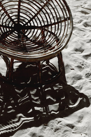 Beach side chairs and tables. Sea view cafe on a sand seashore