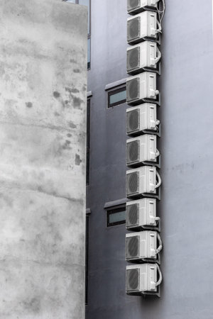 Air conditioner units on building wallの写真素材