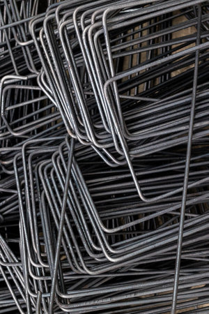 Stack of metal rebar chairs - construction reinforcements.の写真素材