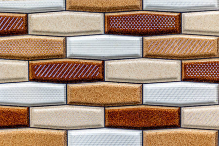 Geometric ceramic tile pattern in brown and white tones.