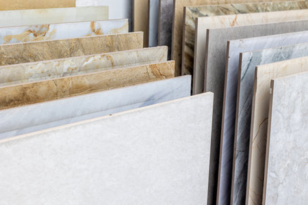 Variety of marble and granite stone slabs displayed in a store.