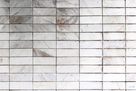 White marble brick wall texture with subtle gray veining.