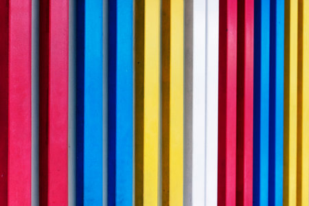 Colorful vertical stripes pattern with red, blue, yellow, and white bars.