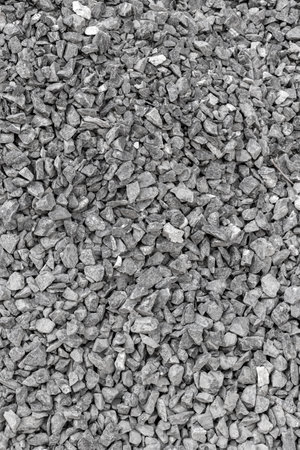 Close-up of gray gravel stones creating a textured surface background.の写真素材