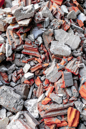 Pile of broken red and gray bricks and concrete rubble.の写真素材