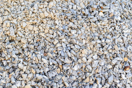 Close-up of gray stone gravel texture for construction and landscaping projects.の写真素材