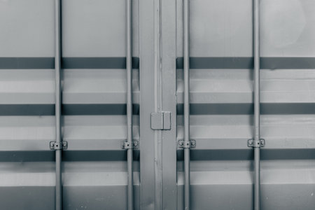 Industrial metal cargo container with closed doors and latches.の写真素材