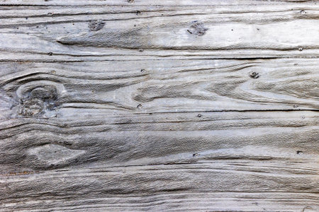 Rustic weathered wooden planks with grain texture background.の写真素材