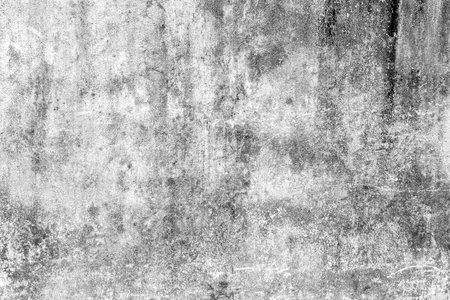 Textured gray concrete wall with subtle grunge and weathered details.の写真素材