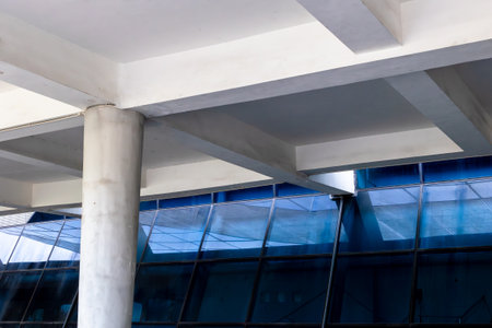 Modern architectural structure with geometric patterns and glass windows.の写真素材
