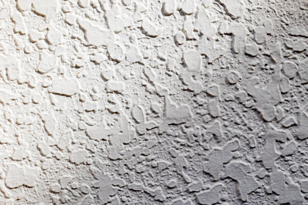 Abstract rough concrete wall texture with light shadows.の写真素材