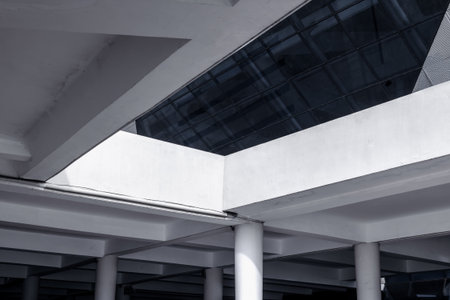 Modern architectural structure with geometric lines and reflections.の写真素材