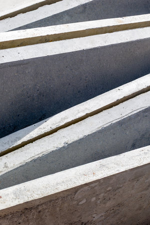 Abstract concrete patterns with symmetrical lines and textures.