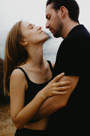 Young caucasian couple embracing at the beach.の写真素材