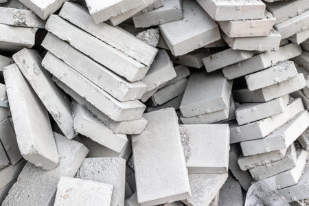 Pile of concrete bricks in various orientations and stacks.の写真素材