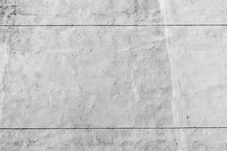Concrete wall texture with subtle lines and minimalist design.の写真素材