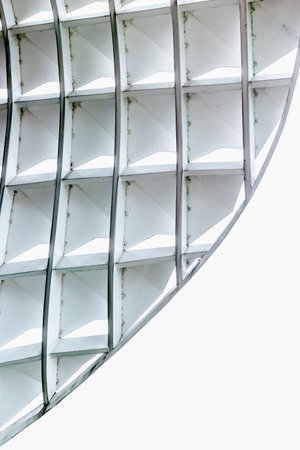 Abstract architectural detail of modern white geometric structure with repetitive pattern.の写真素材