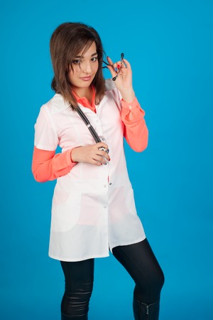 Young student of medicine smiling to camera with stethoscopeの写真素材