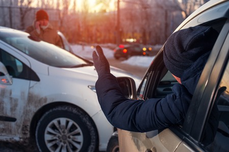 Car crash on winter city streetの写真素材