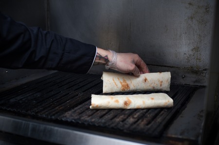 Burrito roll preparing, closeup.の写真素材