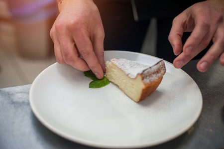 Dessert decoration: sweet tasty pie with mint leafの写真素材