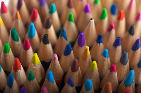 Group of multicolored wooden crayons, macro view