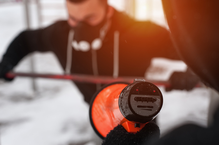 Fitness coach motivating client via loudspeakerの写真素材