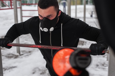 Fitness coach motivating young man via loudspeakerの写真素材