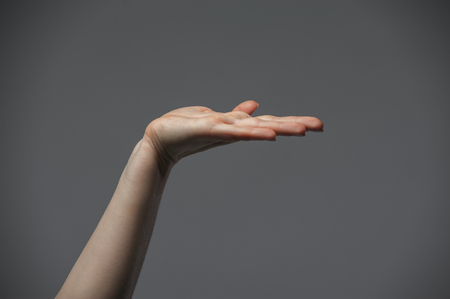 Closeup of female hand on white backgroundの写真素材
