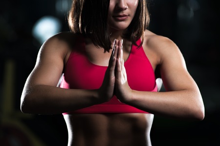Young brunette woman meditating after yogaの写真素材