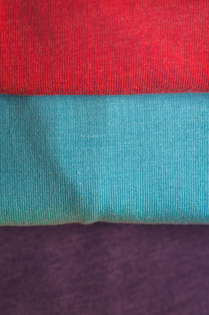 Stack of colorful t-shirts, close upの写真素材