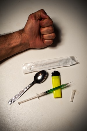 Drug addiction, male using syringe for injectionの写真素材