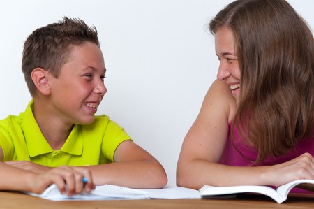 Mother and son doing homework lessons togetherの写真素材