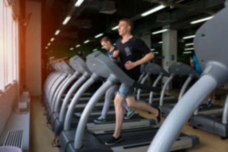 Row of treadmills in modern fitness center.の写真素材